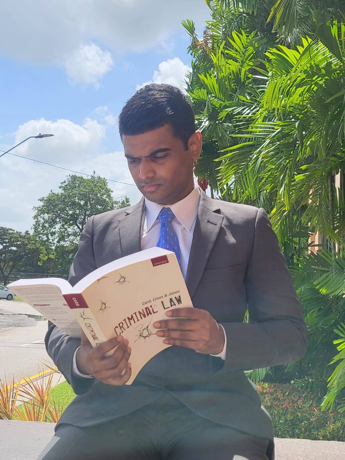 Dmitri Mohammed reviewing filings outdoors